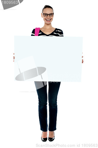 Image of College girl holding white ad board, full length shot
