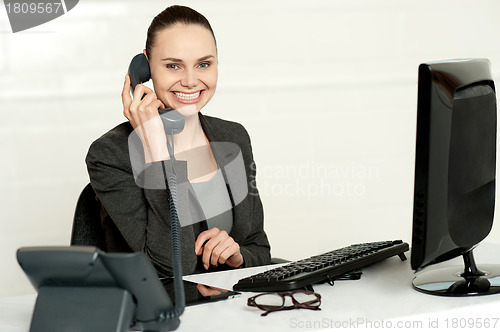 Image of Cheerful secretary advising her client