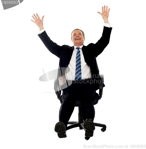 Image of Excited businessman celebrating his success