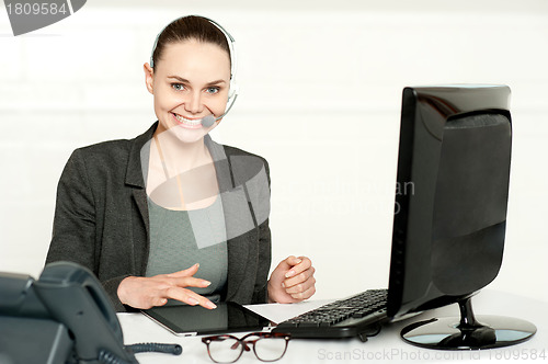 Image of Customer care executive using tablet pc