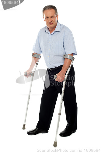 Image of Old handicapped man with a walker