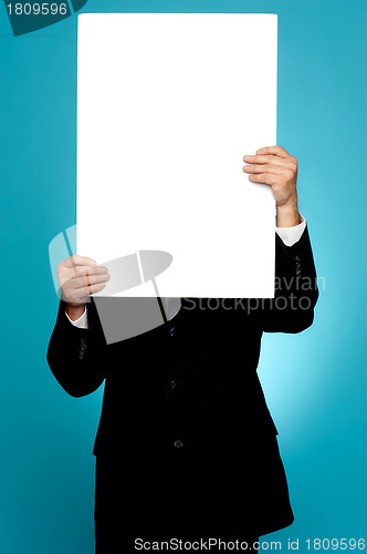 Image of Manager hiding his face behind white banner ad