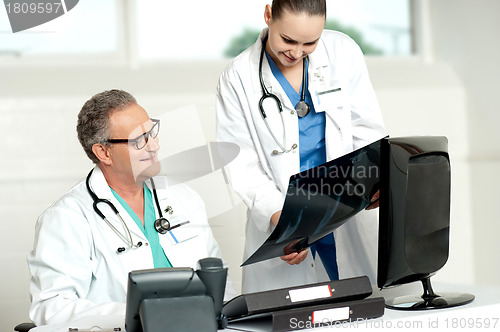 Image of Team of two doctors reviewing x-ray report