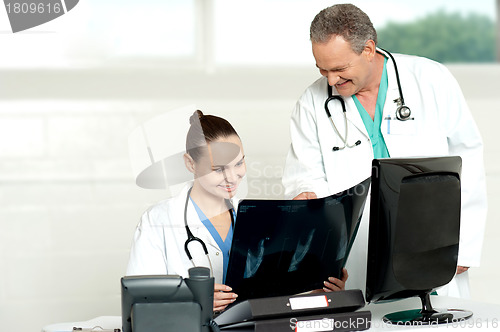 Image of Team of surgeons discussing x-ray report