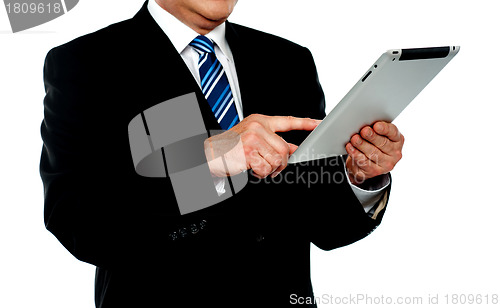 Image of Businessman using tablet, cropped image