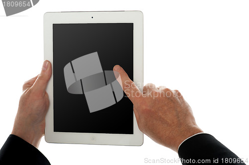 Image of Finger of a man on tablet pc screen, closeup shot