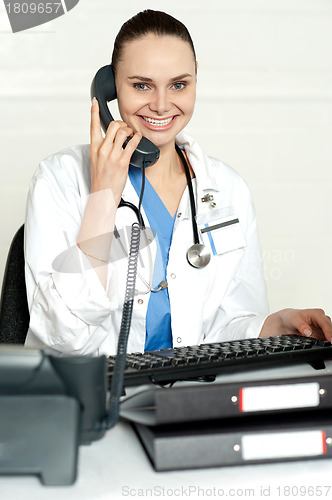 Image of Medical expert communicating on phone