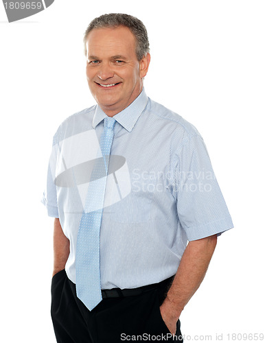 Image of Casual business executive with hands in pocket