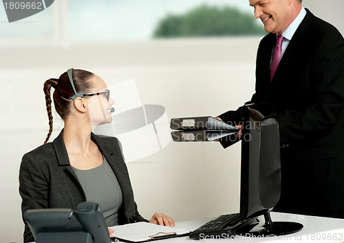 Image of Business team of two working in office