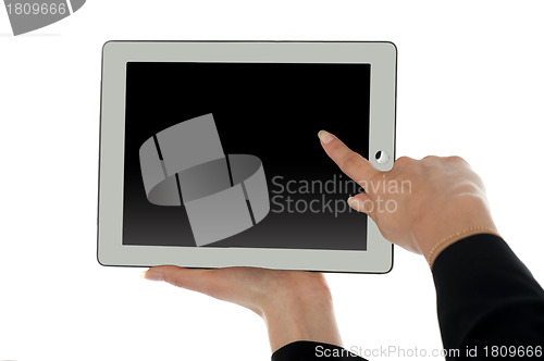 Image of Female finger pointing at blank screen of tablet pc