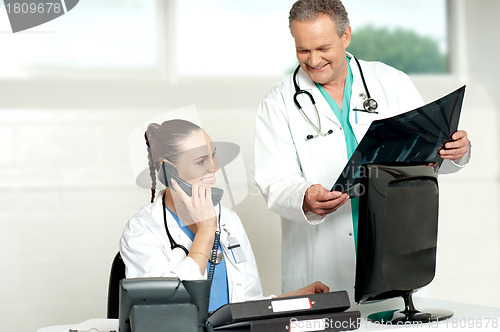 Image of Doctors team in a lab discussing x-ray report