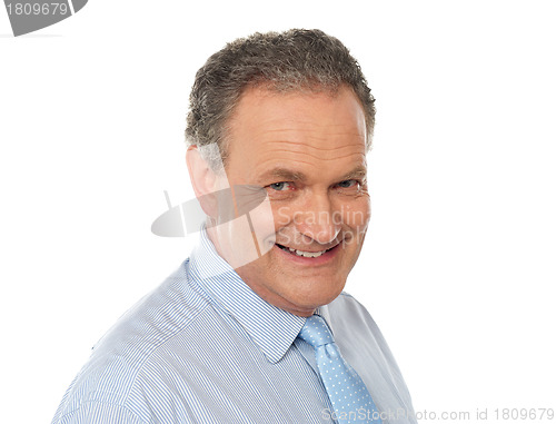 Image of Closeup portrait of smiling senior male executive