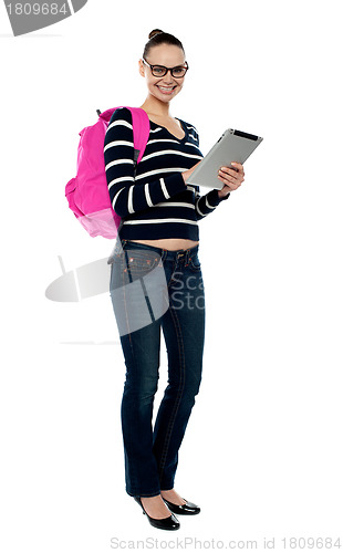 Image of Smiling college girl using tablet pc