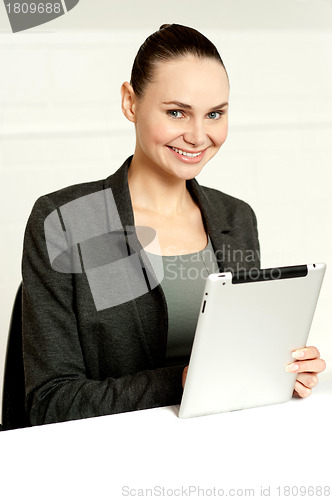 Image of Corporate lady using wireless tablet device