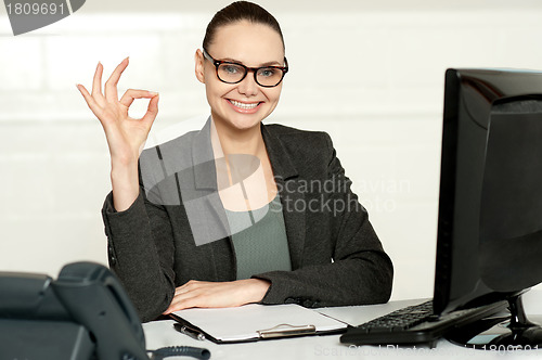 Image of Corporate woman showing excellent gesture