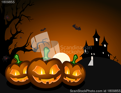 Image of Halloween pumpkin and haunted castle