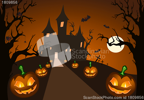 Image of Halloween pumpkin and haunted castle
