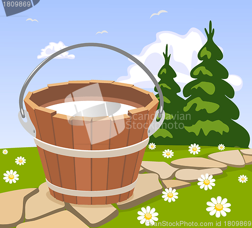 Image of Bucket of milk standing on the sidewalk