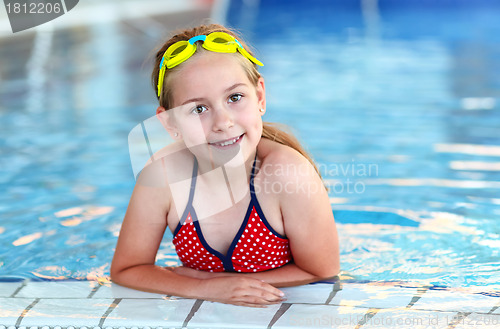 Image of Girl with goggles in swimming pool