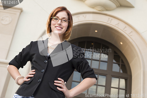 Image of Young Pretty Businesswoman Outside in Front of City Hall
