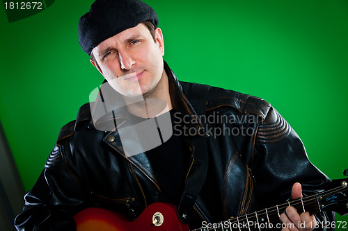 Image of man with a guitar