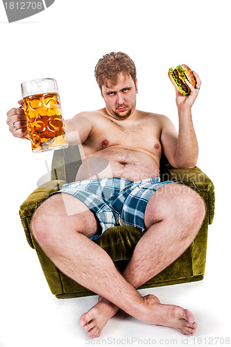 Image of fat man eating hamburger