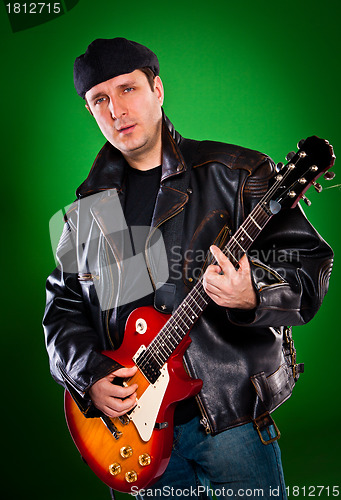 Image of man with a guitar