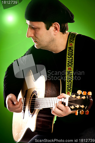 Image of man with a guitar