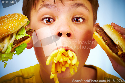 Image of child and fast food.