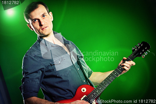 Image of man with a guitar