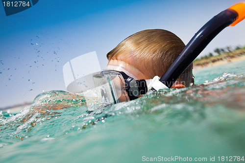 Image of boy floats in the red sea