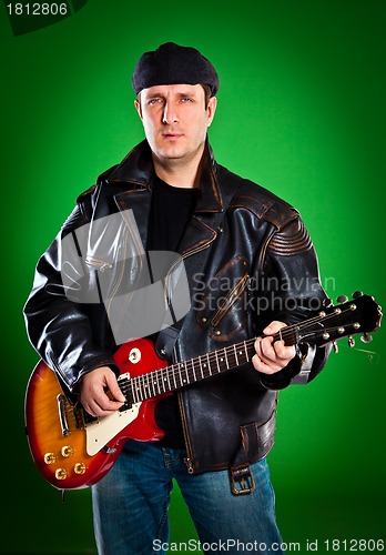 Image of man with a guitar