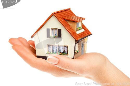 Image of house in human hands