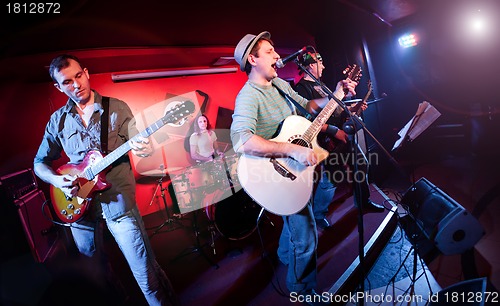 Image of musician plays a guitar