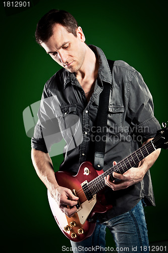 Image of man with a guitar