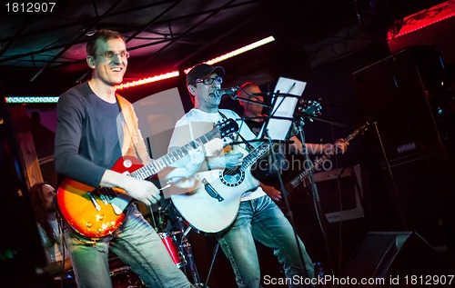 Image of musician plays a guitar