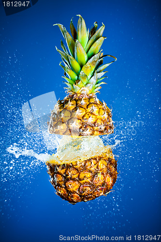 Image of Pineapple splashed with water