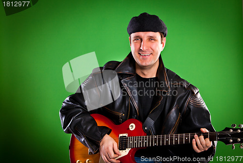 Image of man with a guitar