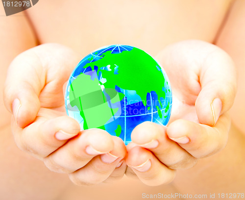 Image of globe in hands