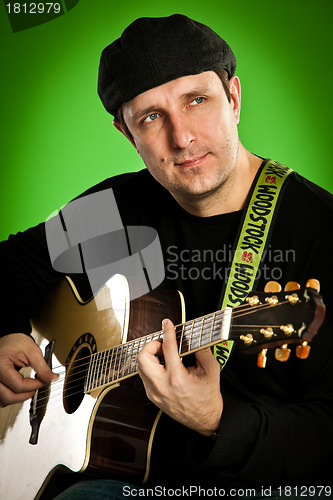 Image of man with a guitar