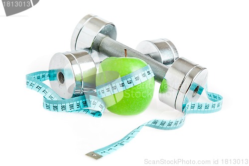 Image of Dumbbells and apple. A healthy way of life