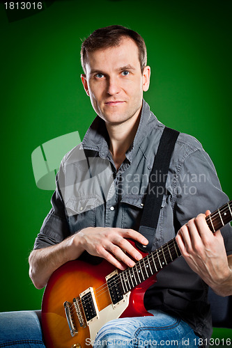 Image of man with a guitar