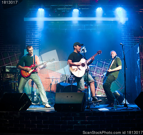 Image of musician plays a guitar