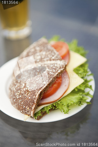 Image of Ham, cheese and tomato sandwich