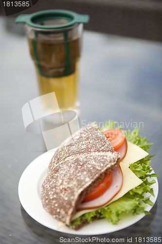 Image of Ham, cheese and tomato sandwich