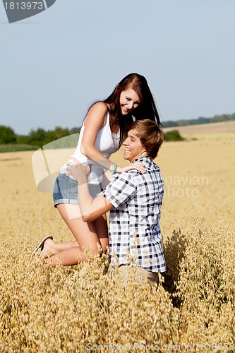 Image of happy couple in love outdoor in summer on field