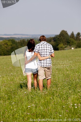 Image of young love couple smiling outdoor in summer 