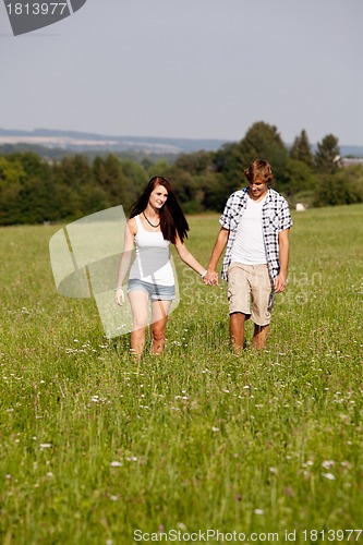 Image of young love couple smiling outdoor in summer 