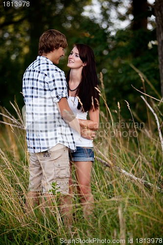 Image of young love couple smiling outdoor in summer 