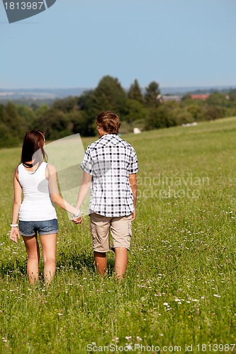 Image of young love couple smiling outdoor in summer 